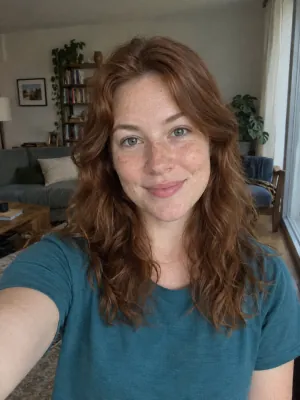 A selfie of one woman facing the camera in soft daylight