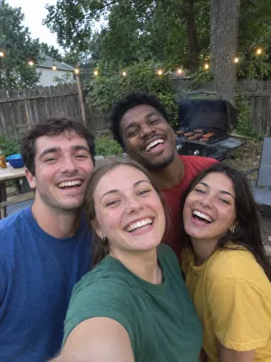 Four friends squeezed into one selfie